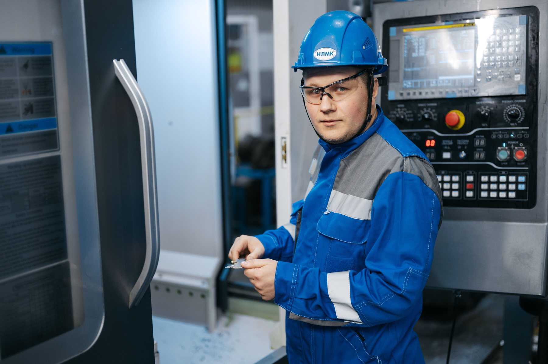 Industrial technician working at a CNC machine