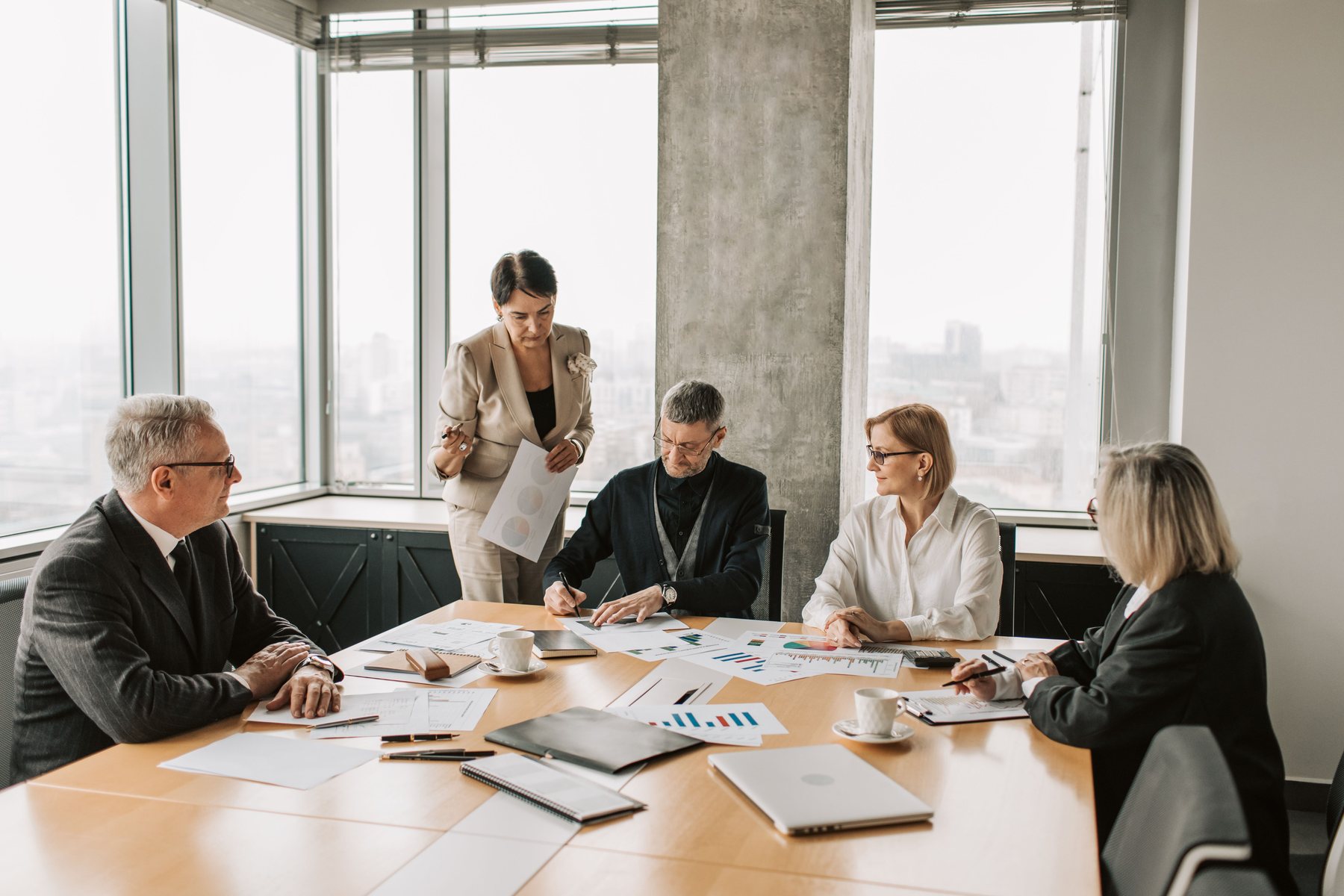 Professionals reviewing financial information in a meeting